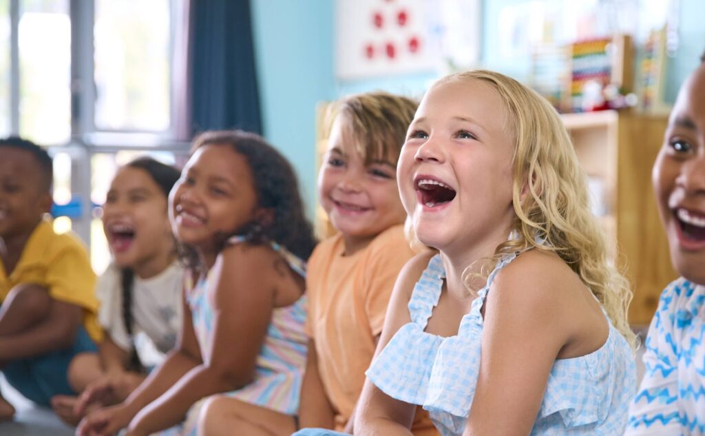 line of smiling elementary school students